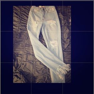 Blue denim cut up jeans with fridge size 3